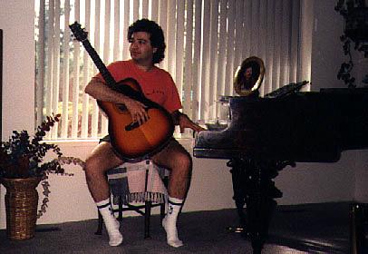At piano with guitar